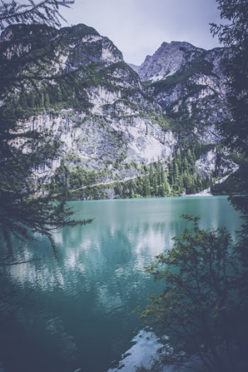 Lake Near White Mountain With Trees during Daytime
