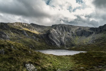 Lake Surrounded By Mountain