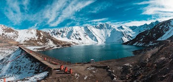 Lake Surrounded With Mountain Covered With Snow