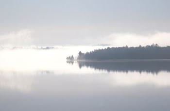 lake under white clouds during daytime view