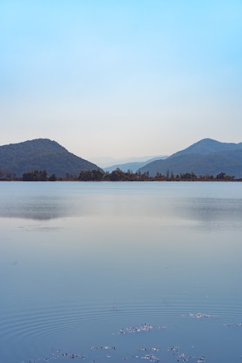 Lake with Mountains in Background