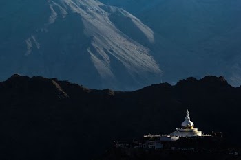 landscape of mosque near mountain