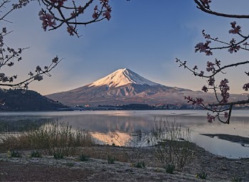 Landscape Photo of a Snowy Top Mountain Near Body of Water
