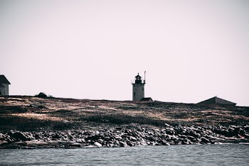 Landscape Photo of a White and Black Lighthouse