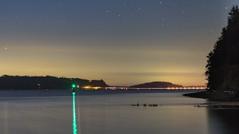 Landscape Photo of an Ocean and a Green Buoy