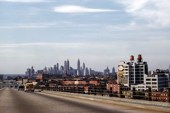 landscape photo of buildings near fly over during daytime