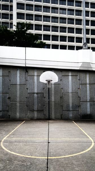 landscape photo of portable basketball hoop on court