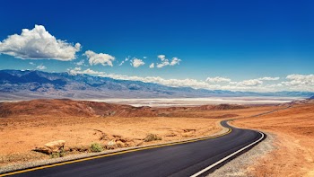 Landscape Photo of Road Under Blue Sky