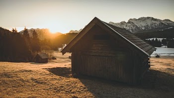 landscape photo of wooden house during sunset