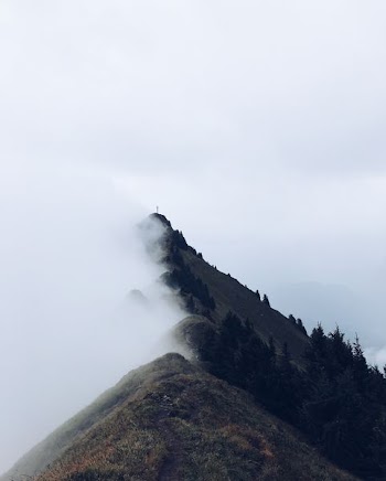 landscape photograph of mountain with fogs