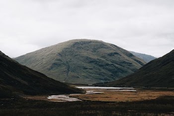 landscape photograph of river between hills