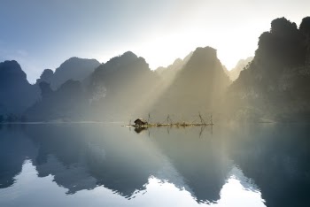 Landscape Photography of Brown Wooden House on Body of Water