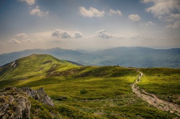 Landscape Photography of Grass-covered Rock Formation