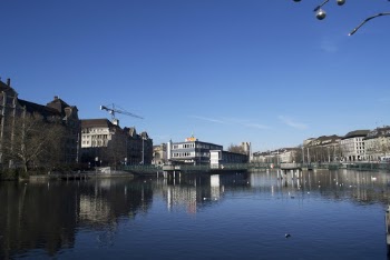 Landscape Photography of High Rise Building Near Body of Water