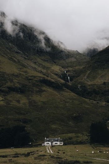 landscape photography of house under mountain