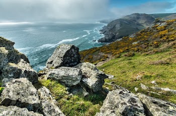 Landscape Photography of Mountain Beside Beach Shoreline