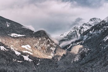 landscape photography of mountain with clouds above