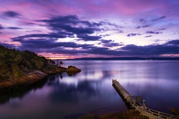 landscape photography of mountains and body of water