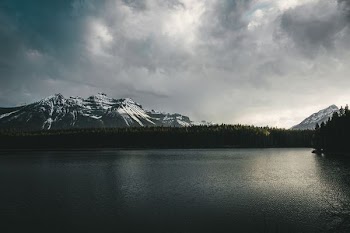landscape photography of mountains near body of water