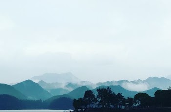 landscape photography of mountains nearby sea