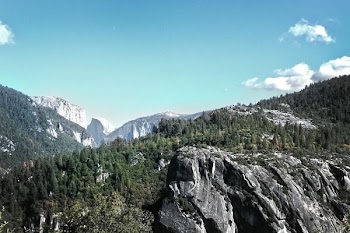 landscape photography of rock formation near green trees