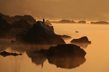 Landscape Photography of Rocky Mountain With Human on Peak of Mountain