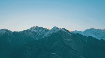 Landscape Photography Of Snow Capped Mountains