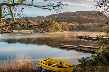 Landscape Photography of Yellow Punt Boat on Shoreline