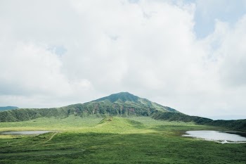 Landscape View With Mountain In Distance