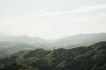 Landscape With Misty Hills In Distance