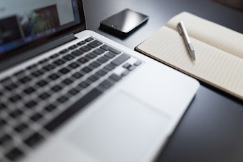          Laptop & Notepad on Desk Free Photo     