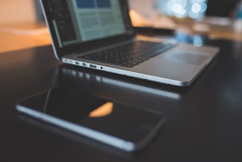 Laptop Computer &amp; iPhone on Black Desk