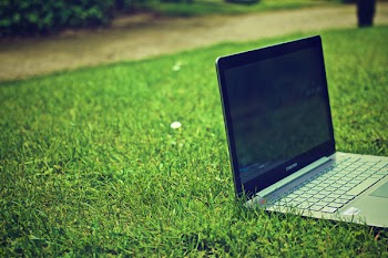          Laptop Computer on Grass Free Photo     