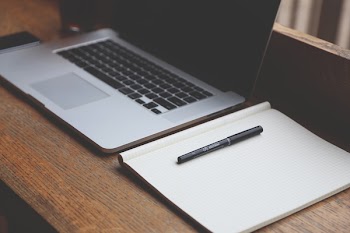          Laptop, Notepad & Pen on Desk Free Photo     