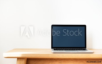 Laptop on a wooden table