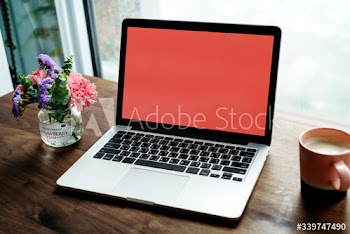 Laptop on a wooden table