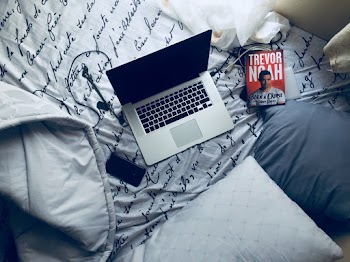 laptop on bed  