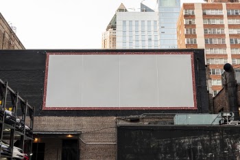 Large mock-up billboard on a building Free Photo