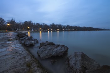 Large Rocks in Bay Under White and Blue Cloudy Sky
