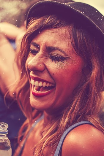 Laughing Woman Wearing Blue Tank Top