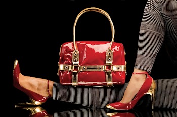 Leisure bag. A close-up of a chic red handbag along with sexy female legs wearing elegant red shoes.