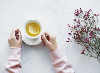 Lemonade Juice Filled White Ceramic Cup With Saucer