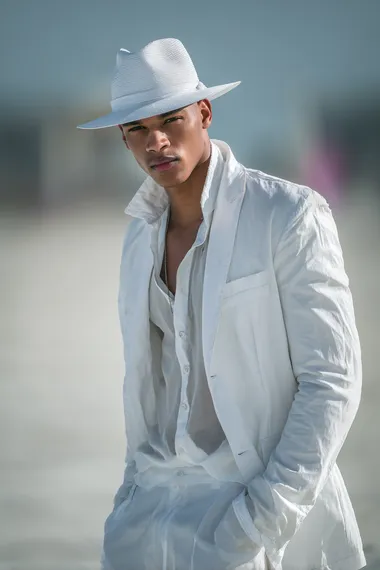 LGBTQ Male Model in White Fashion by the Beach LGBTQ Male Model in White Fashion by the Beach