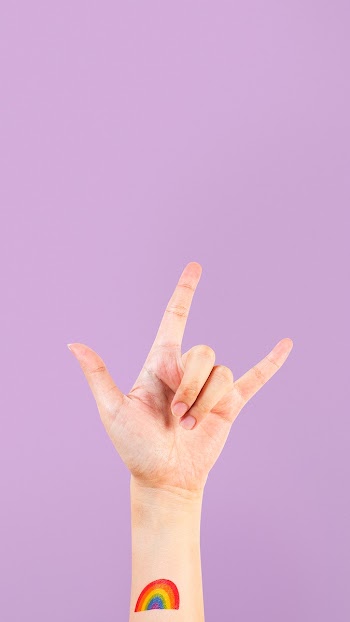 LGBTQ+ pride tattoo with rock n' roll hand in… | Free stock photo | High Resolution image