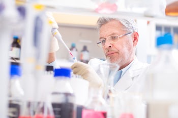 Life scientist researching in laboratory. Life sciences comprise fields of science that involve the scientific study of living organisms: microorganism, plant, animal and human cells, genes, DNA...