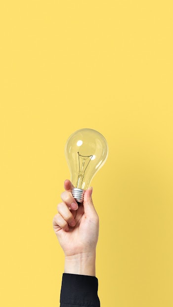 Light bulb creative business idea symbol held… | Free stock photo | High Resolution image