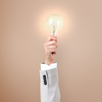Light bulb creative business idea symbol held… | Free stock photo | High Resolution image