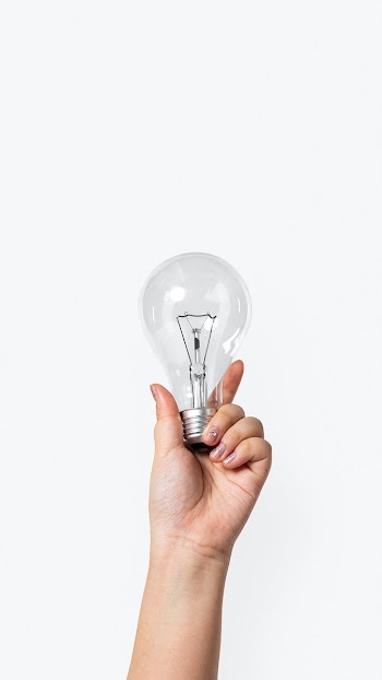 Light bulb creative business idea symbol held… | Free stock photo | High Resolution image