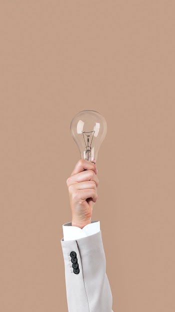 Light bulb creative business idea symbol held… | Free stock photo | High Resolution image