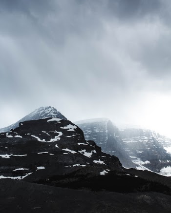 Light rays penetrate the clouds above Jasper's sub-zero temperature glaciers.